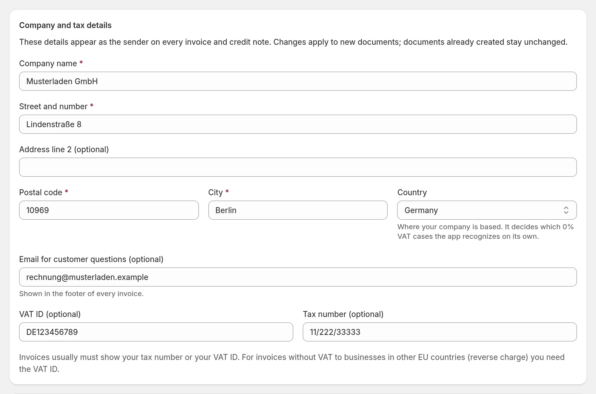 Settings section Company and tax details with company name, address, country, VAT ID and tax number